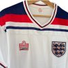 camiseta-inglaterra-82-home-Photoroom.jpg Camiseta Inglaterra 1982 – Local