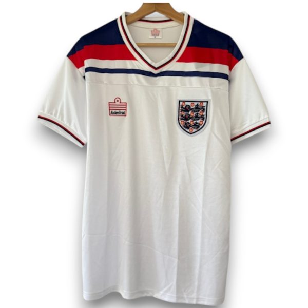 camiseta-inglaterra-82-local-Photoroom.jpg Camiseta Inglaterra 1982 – Local